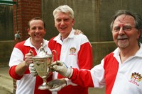 JCC president Bruce Todd, centre, presents the trophy to Les Jacobs, left, and David Cooper, right