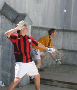 Alex Kasterine, in orange, preparing to receive the cup